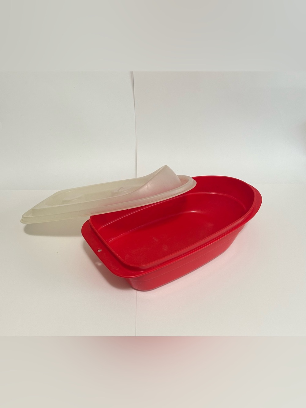 Vintage 1980s Tupperware “Tuppertoys” red boat with lid